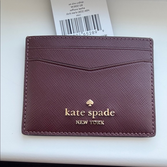 kate spade Handbags - kate spade card holder in plum with gold logo